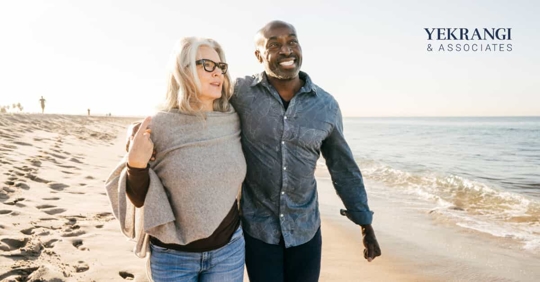 A happy couple walking on the beach