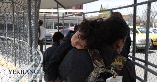 Child and mother walking through immigration