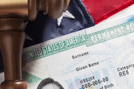 Immigration concept. United States Permanent Resident with gavel and identification card