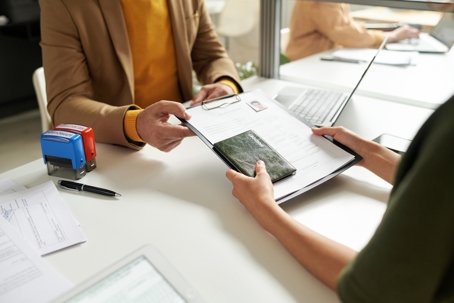 Woman working on immigration case with another person
